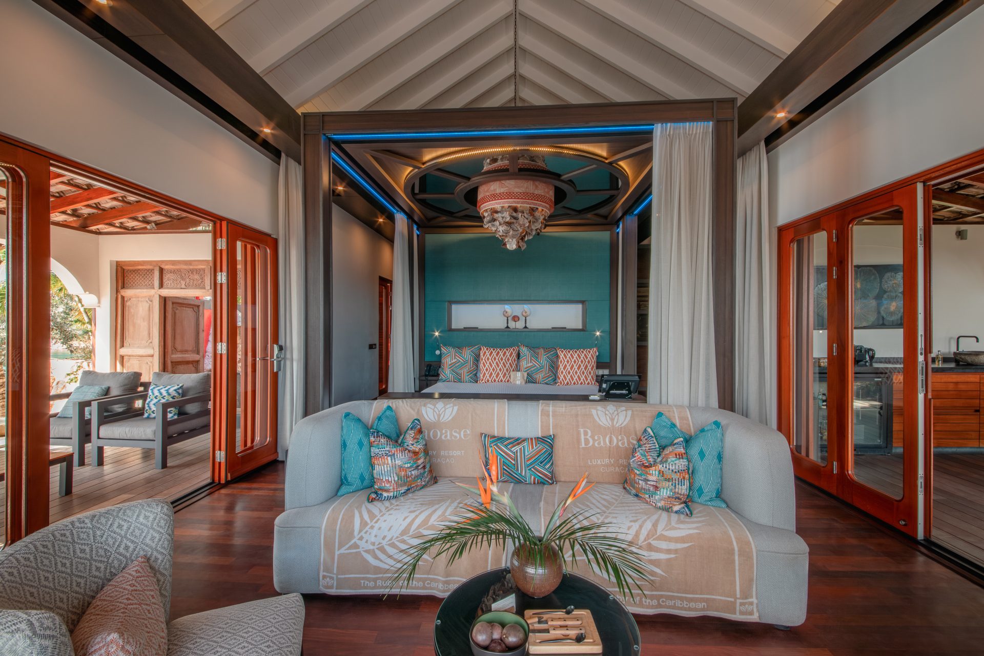 Luxury bedroom in Superior Beachfront Pool Suite with king-size bed and tropical design