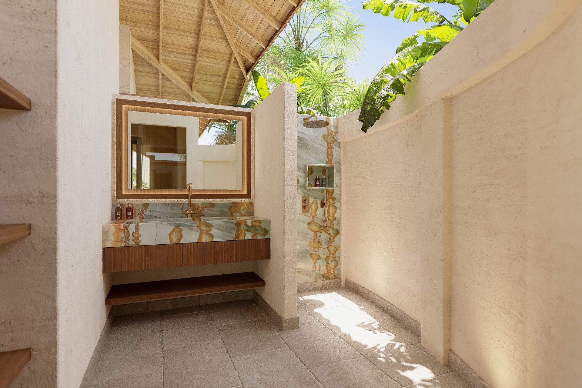 Outdoor bathroom with a rain shower and natural stone vanity in the Junior Suite at Baoase Curaçao